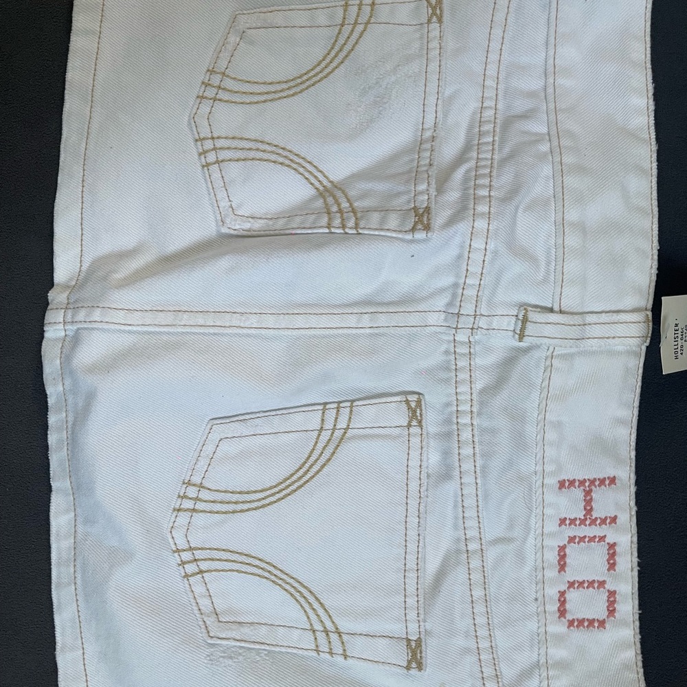 White Denim Skirt with Embroidered Pockets